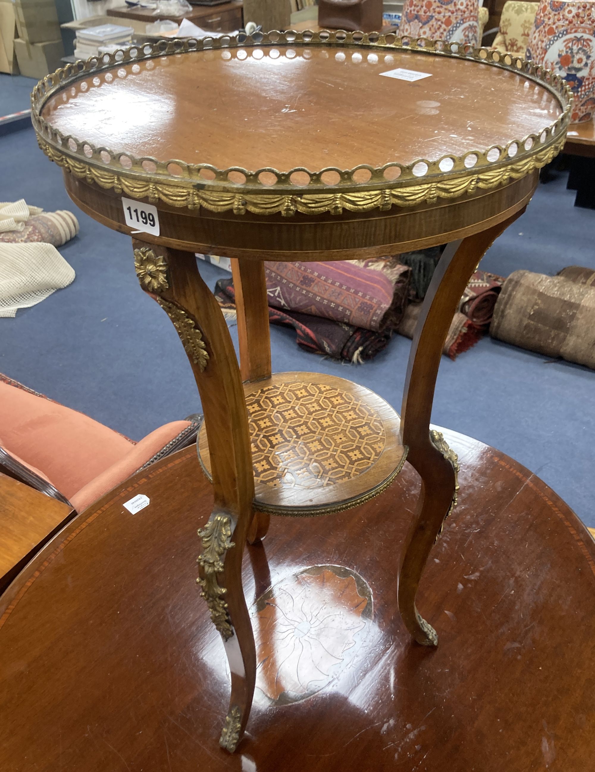 A Louis XVI style inlaid mahogany and ormolu mounted two tier gueridon, diameter 45cm, height 76cm